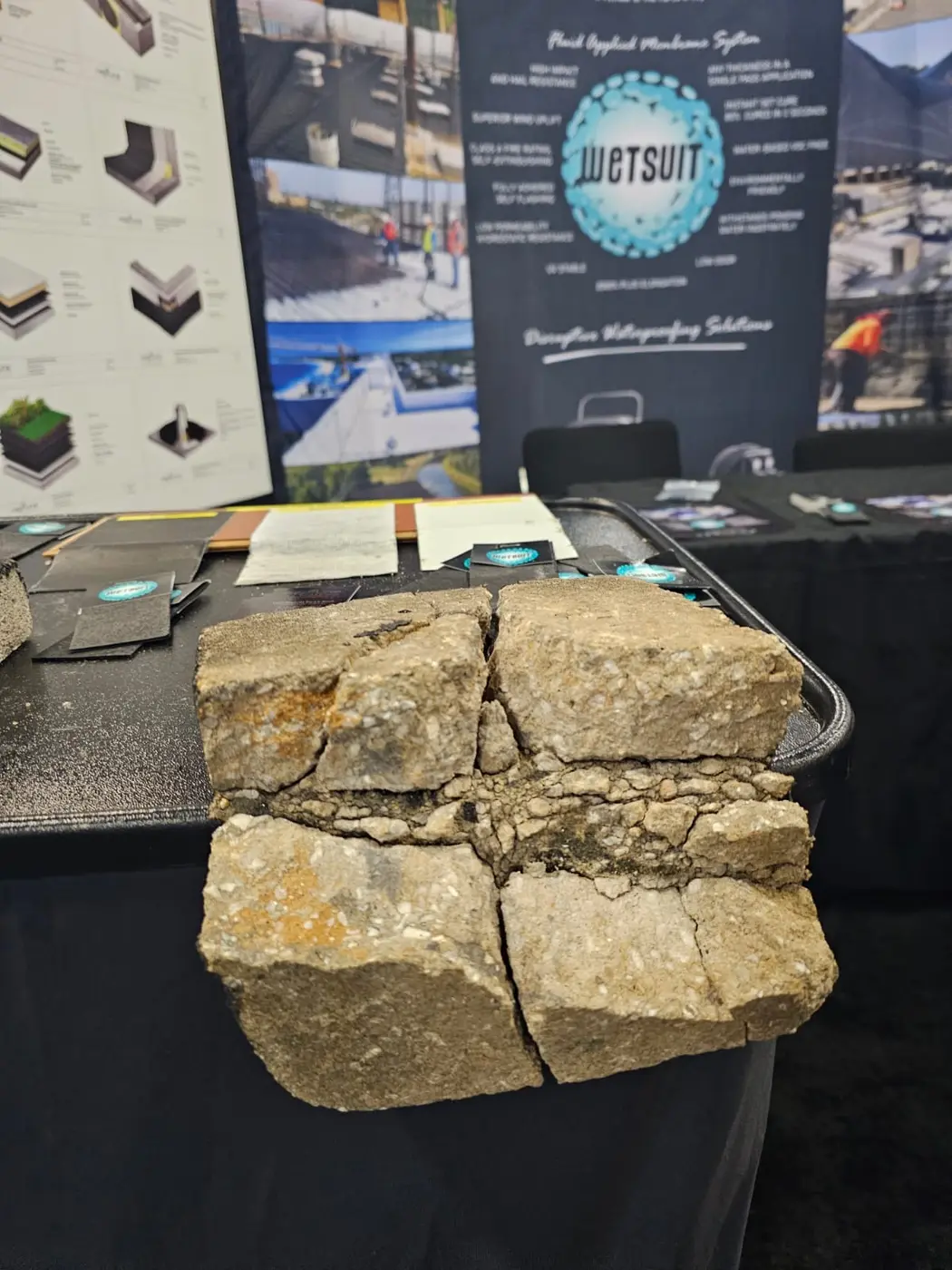Shattered brick still held together by a cured layer of Wetsuit membrane